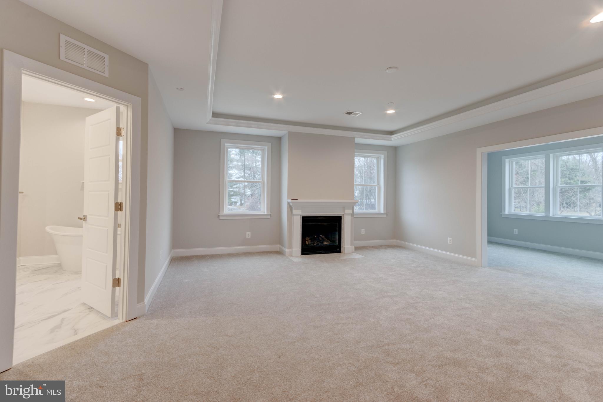 3114 Mt Zion Road Upperco, MD 21155 - Photo 45 of 61 an empty room with windows and fireplace