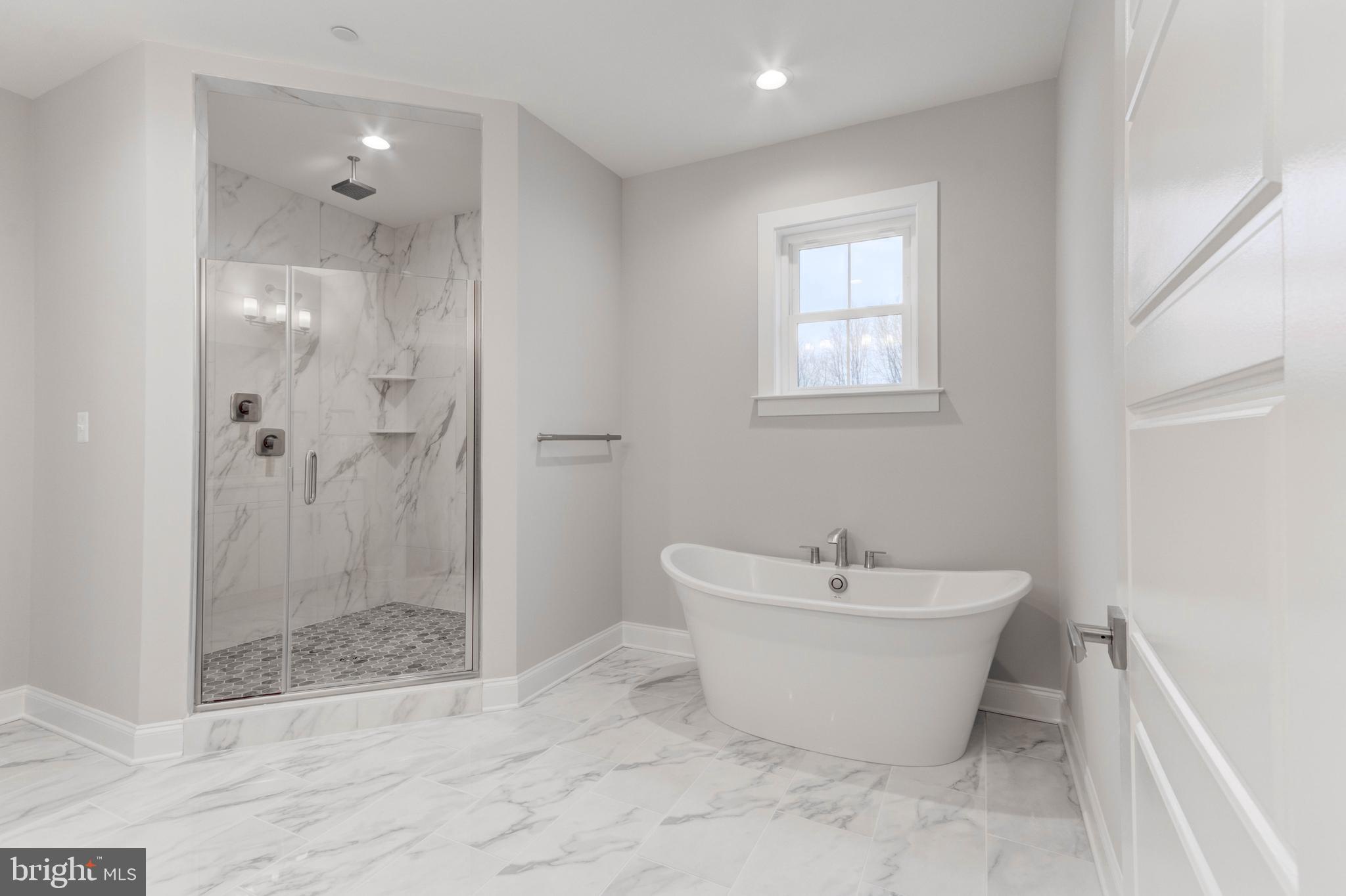 3114 Mt Zion Road Upperco, MD 21155 - Photo 53 of 61 a bathroom with a white tub shower