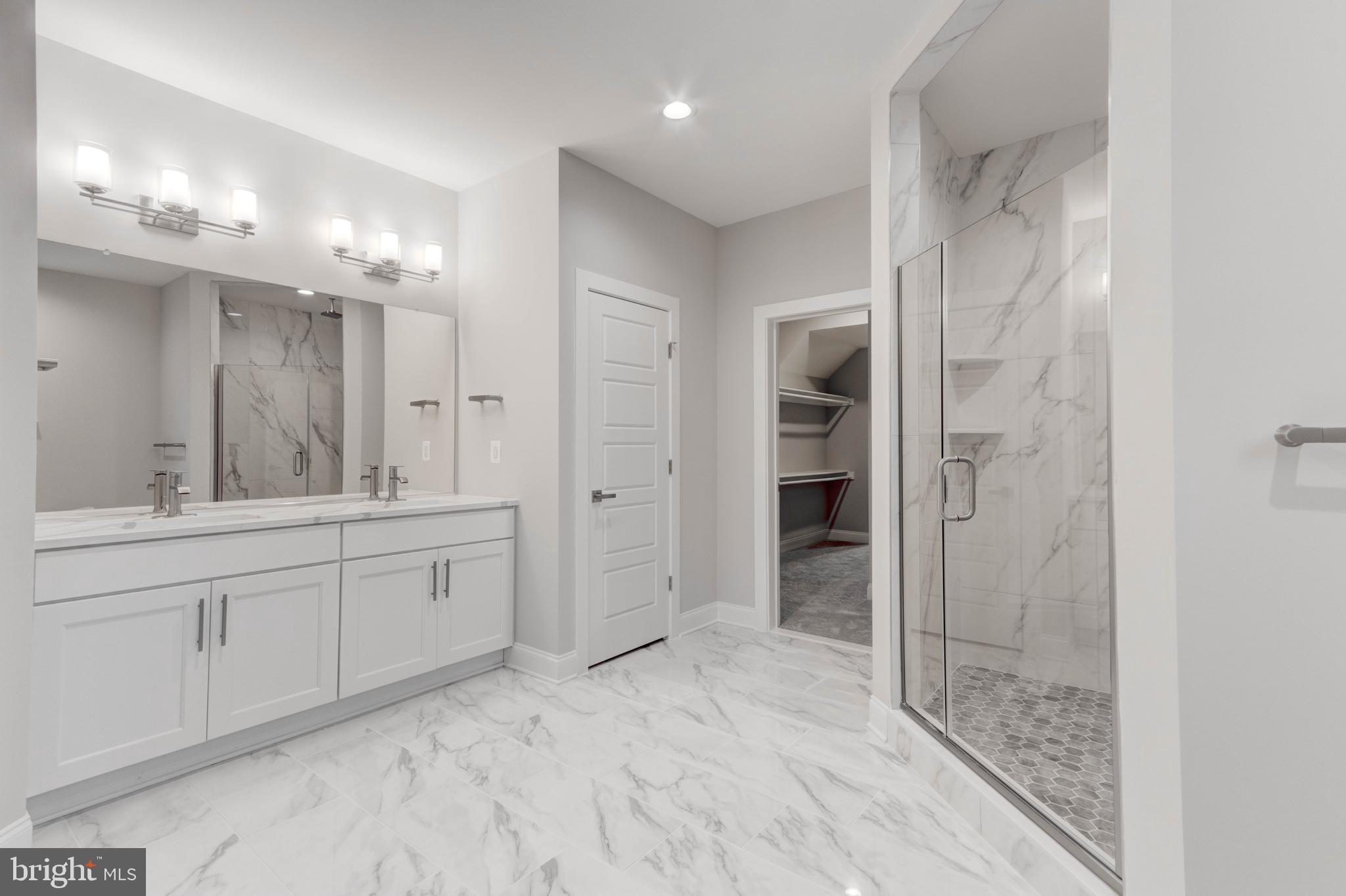 3114 Mt Zion Road Upperco, MD 21155 - Photo 54 of 61 a spacious bathroom with a shower a sink and a mirror