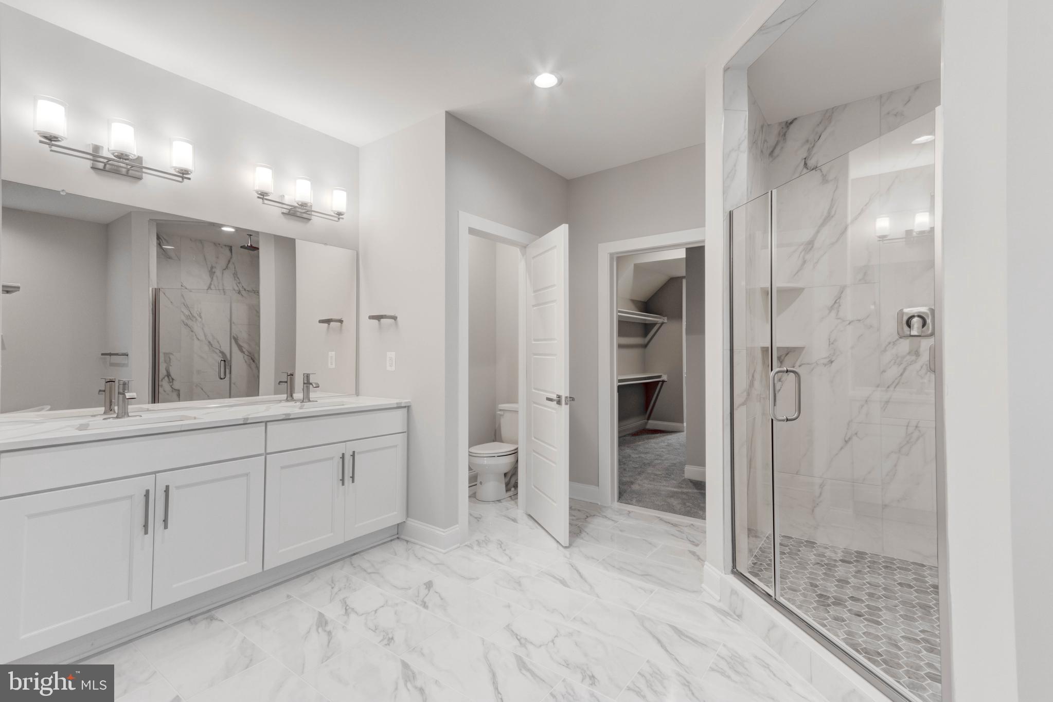 3114 Mt Zion Road Upperco, MD 21155 - Photo 55 of 61 a bathroom with a double vanity sink mirror and shower