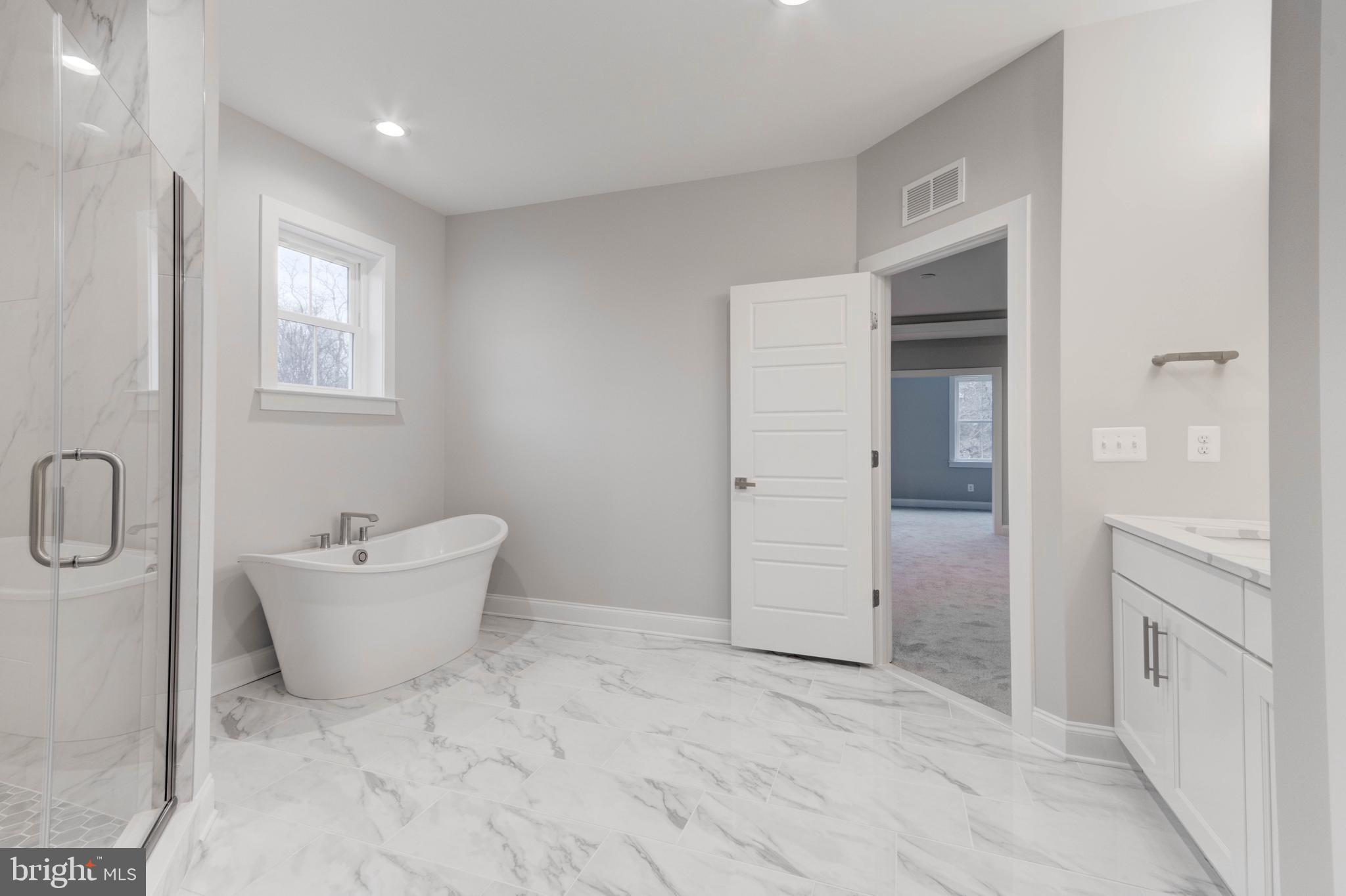 3114 Mt Zion Road Upperco, MD 21155 - Photo 56 of 61 a bathroom with a bathtub sink mirror and toilet