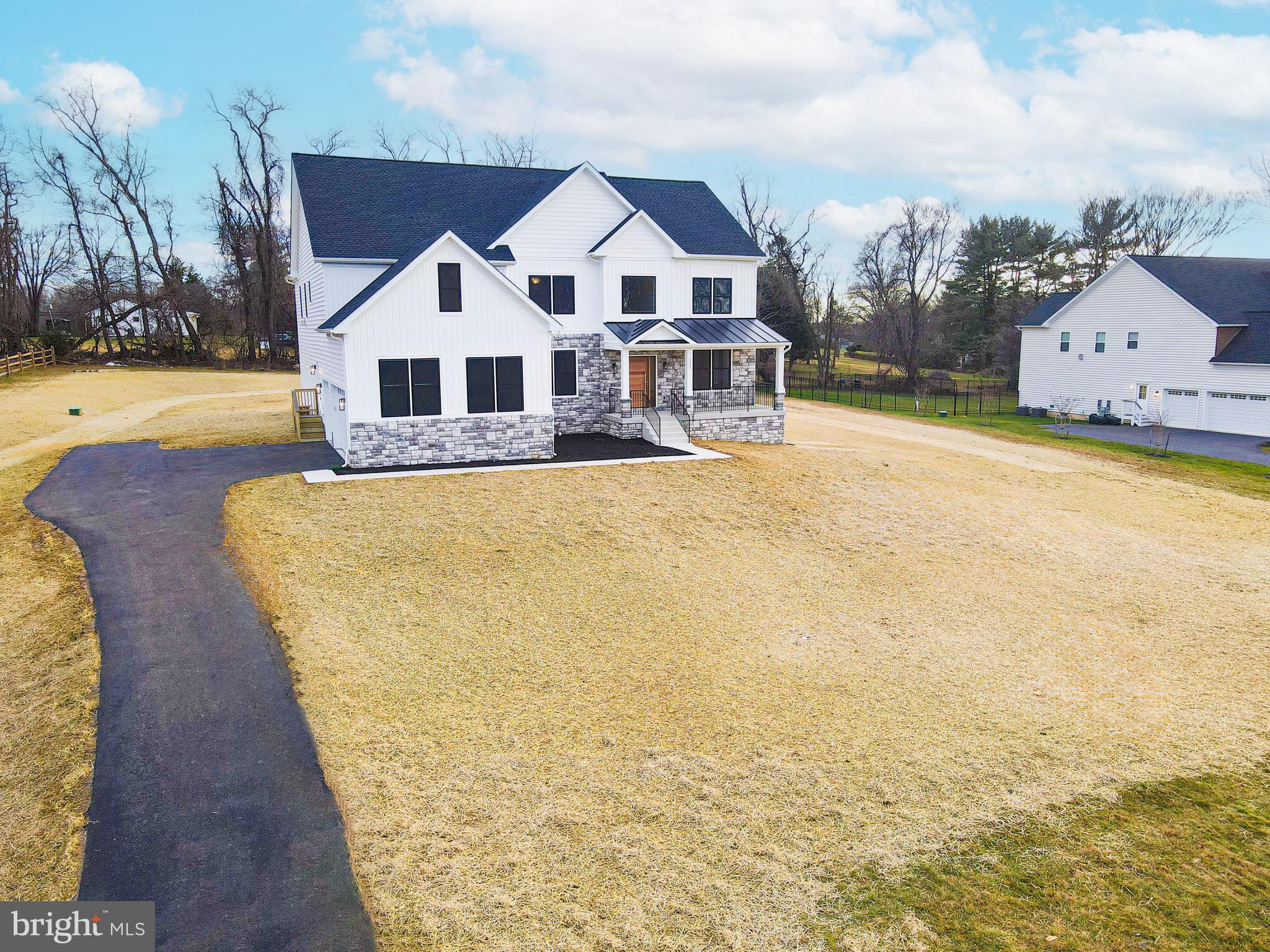 3114 Mt Zion Road Upperco, MD 21155 - Photo 7 of 61 a view of a white house with a big yard and large trees
