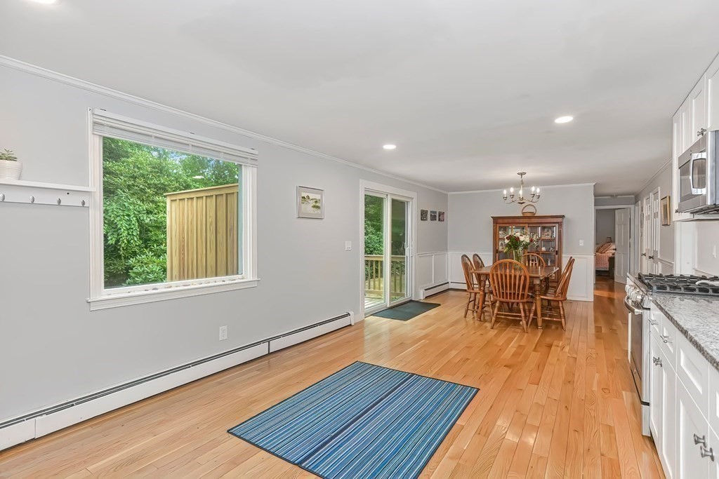 79 Emerson Way Barnstable, MA 02632 - Photo 12 of 29 a dining room with wooden floor and large window
