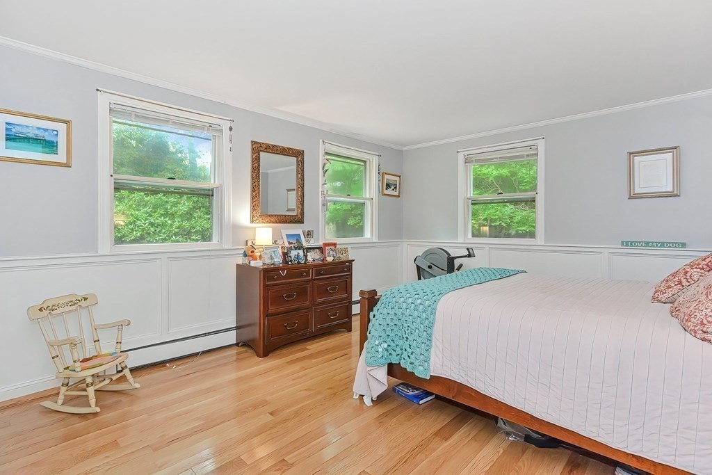 79 Emerson Way Barnstable, MA 02632 - Photo 15 of 29 a bedroom with a bed and wooden floor