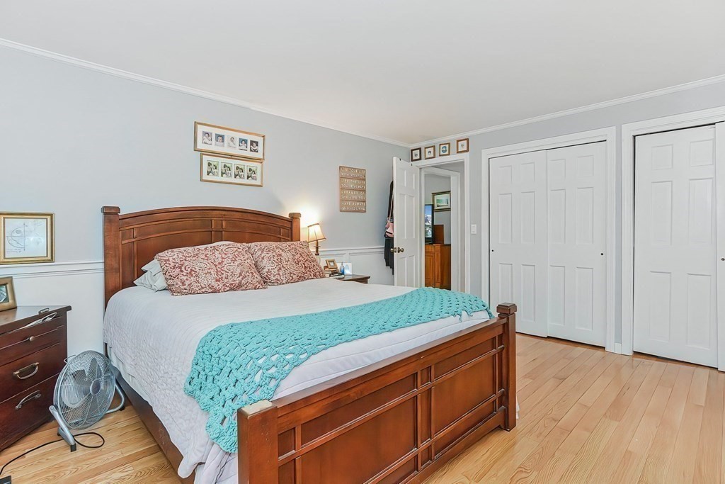 79 Emerson Way Barnstable, MA 02632 - Photo 16 of 29 a bedroom with a bed and a dresser