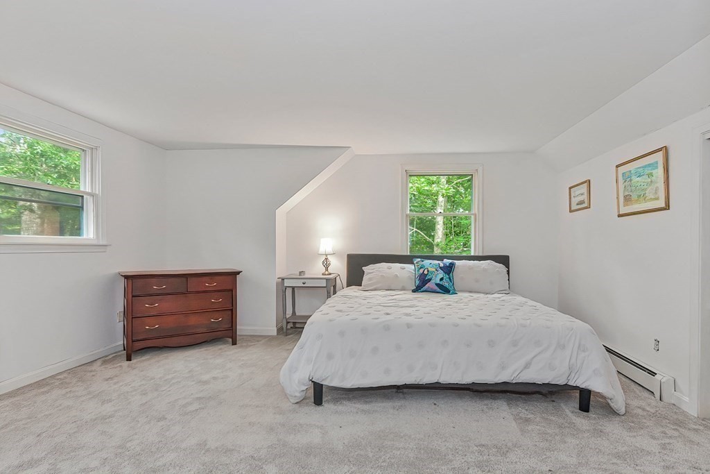 79 Emerson Way Barnstable, MA 02632 - Photo 17 of 29 a bedroom with a bed and a dresser