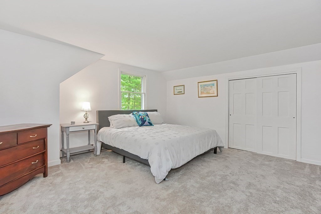 79 Emerson Way Barnstable, MA 02632 - Photo 18 of 29 a spacious bedroom with a bed and window