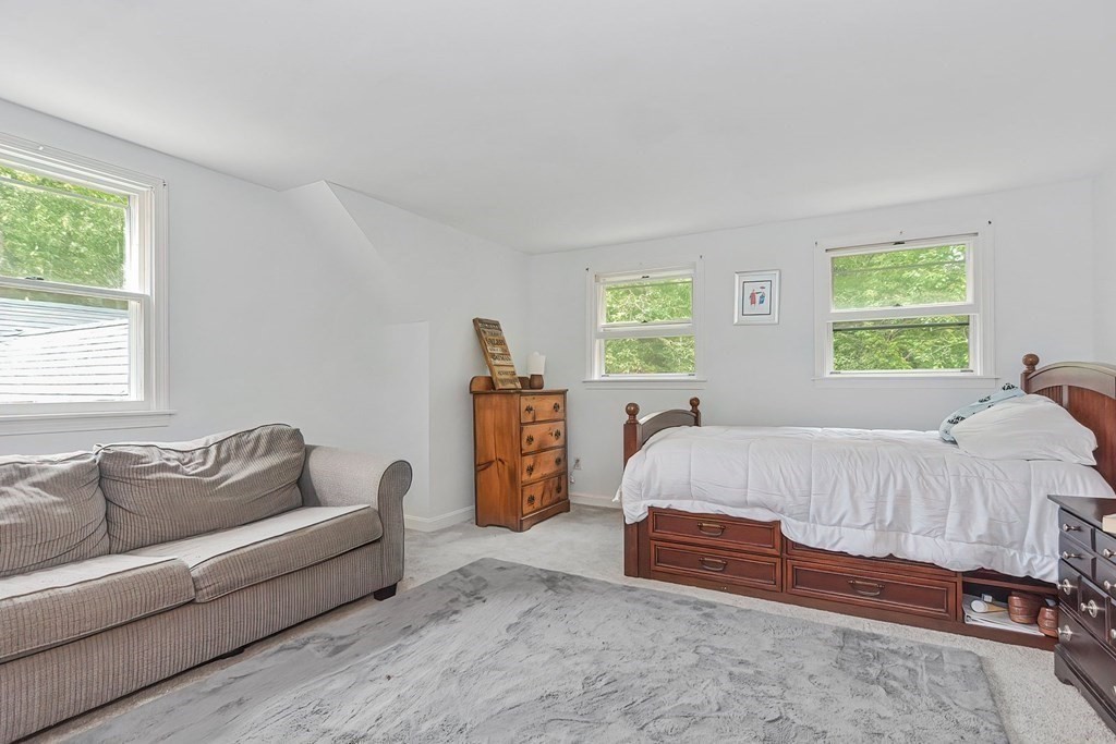 79 Emerson Way Barnstable, MA 02632 - Photo 20 of 29 a bed room with a bed and a couch