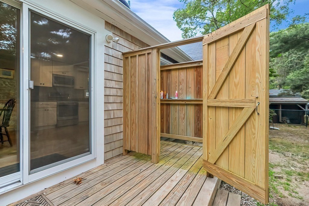 79 Emerson Way Barnstable, MA 02632 - Photo 25 of 29 a view of balcony with wooden floor and fence