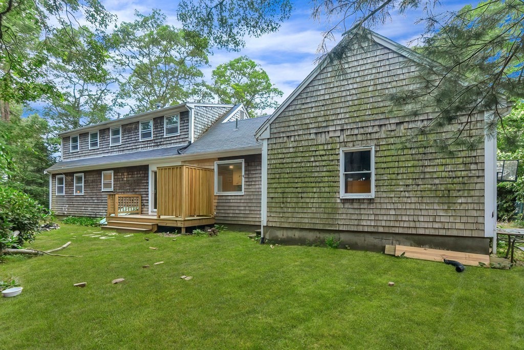79 Emerson Way Barnstable, MA 02632 - Photo 27 of 29 a front view of a house with a yard