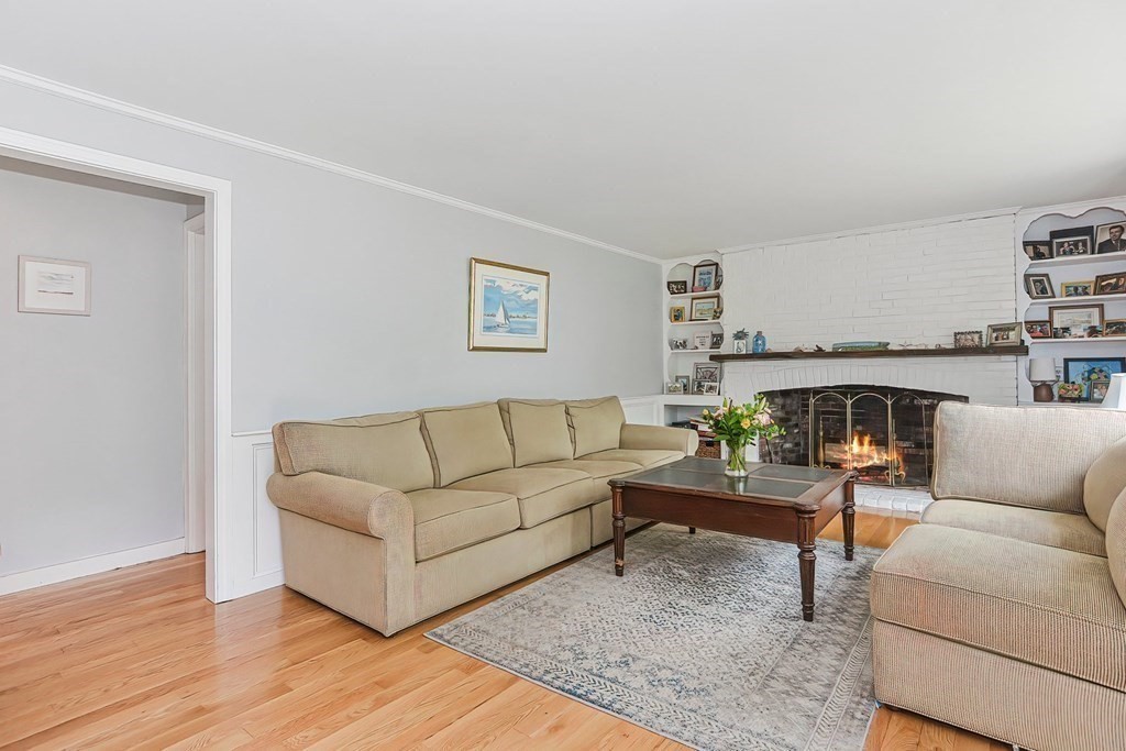 79 Emerson Way Barnstable, MA 02632 - Photo 5 of 29 a living room with furniture and a fireplace