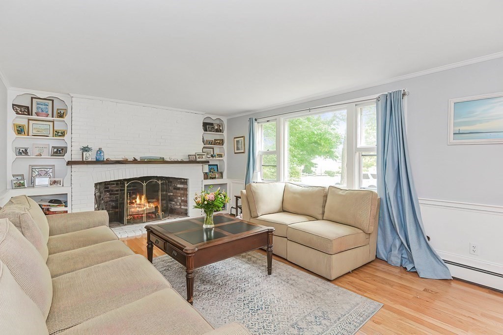 79 Emerson Way Barnstable, MA 02632 - Photo 6 of 29 a living room with furniture and a fireplace
