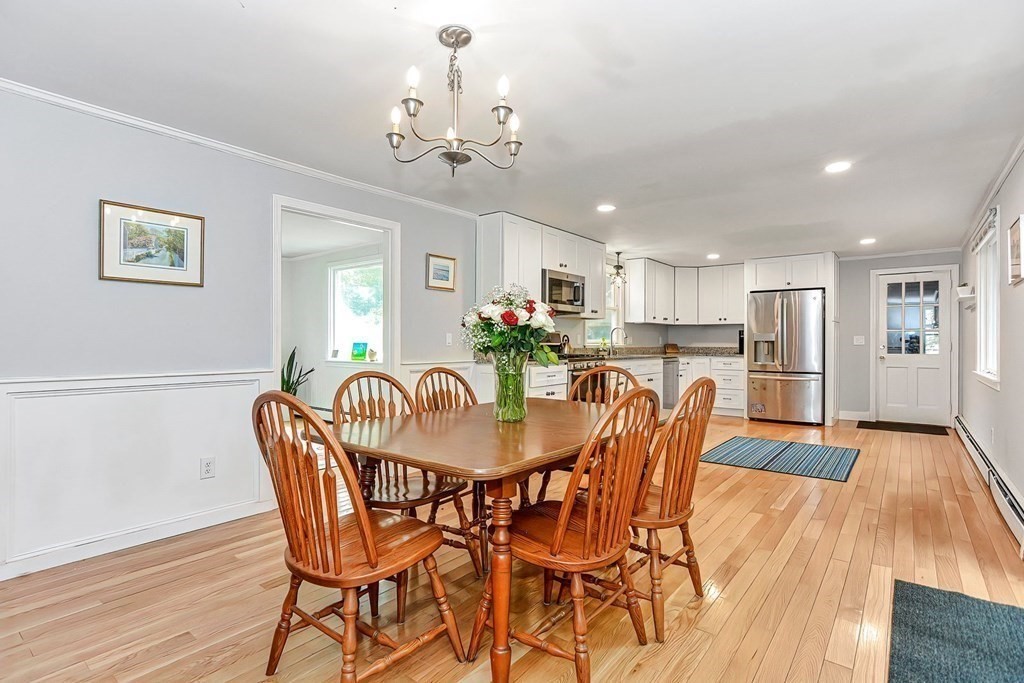 79 Emerson Way Barnstable, MA 02632 - Photo 9 of 29 a view of a dining room with furniture and wooden floor