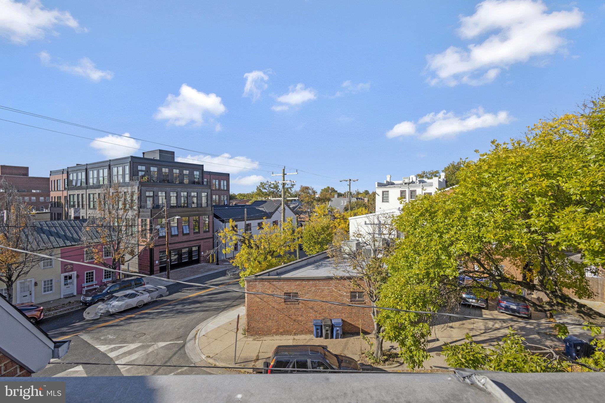 116 Commerce Street Alexandria, VA 22314 - Photo 28 of 50 Charming urban view with vibrant trees.