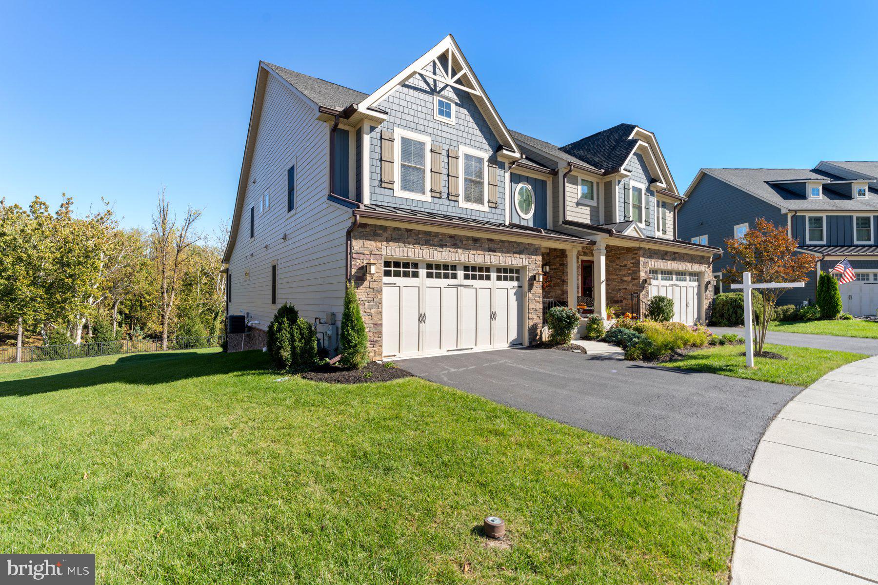 6931 Summit Circle Baltimore, MD 21239 - Photo 2 of 39 a front view of a house with a yard and trees