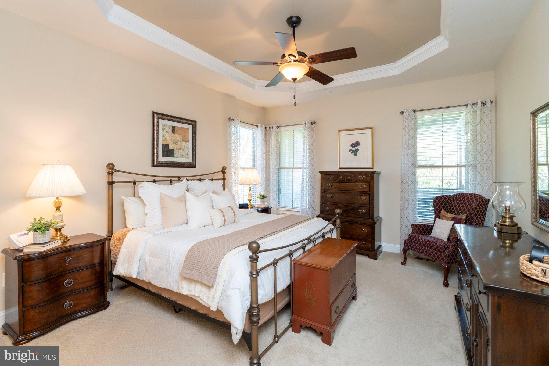 6931 Summit Circle Baltimore, MD 21239 - Photo 23 of 39 a bedroom with a bed couch and windows