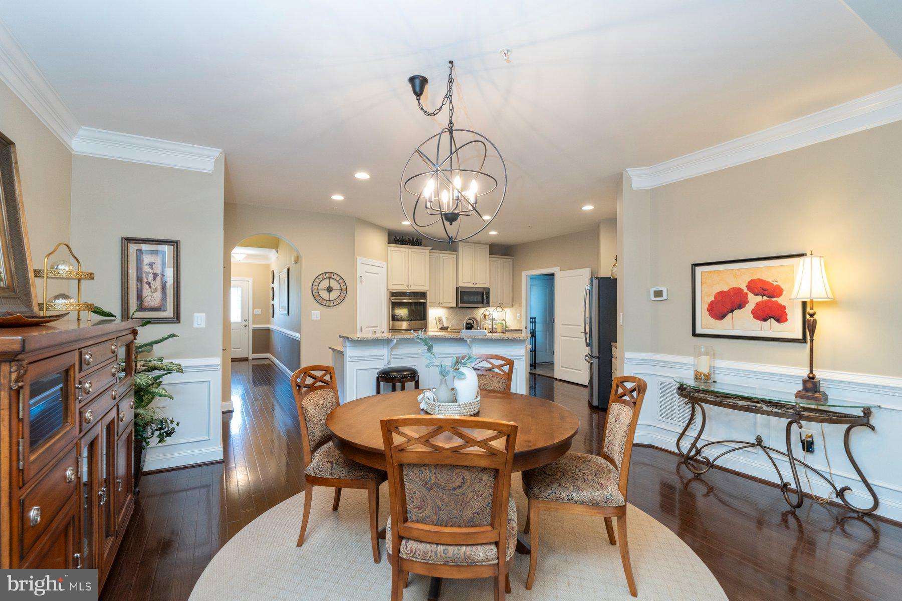 6931 Summit Circle Baltimore, MD 21239 - Photo 8 of 39 a view of a dining room with furniture and wooden floor
