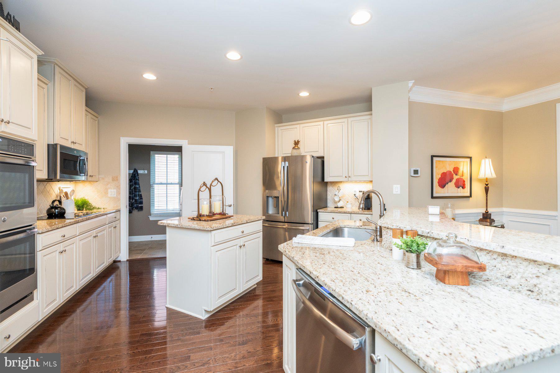 6931 Summit Circle Baltimore, MD 21239 - Photo 10 of 39 a kitchen with stainless steel appliances granite countertop a sink stove and refrigerator