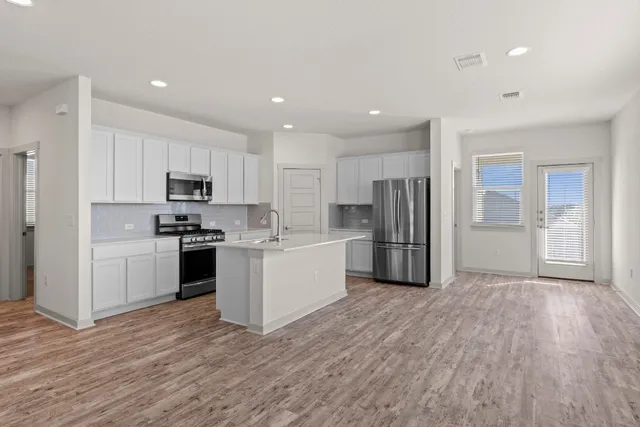 a bathroom with a double vanity sink and mirror