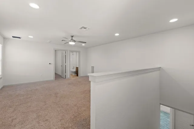 a bathroom with a granite countertop sink a toilet and shower