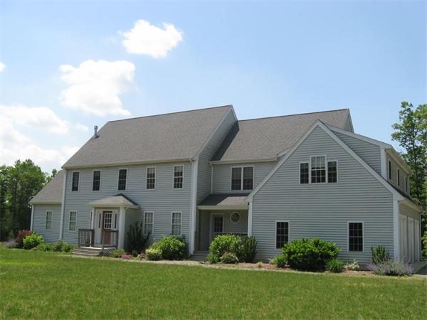 173 County Road Rochester, MA 02576 - Photo 3 of 6 a front view of a house with a yard and trees