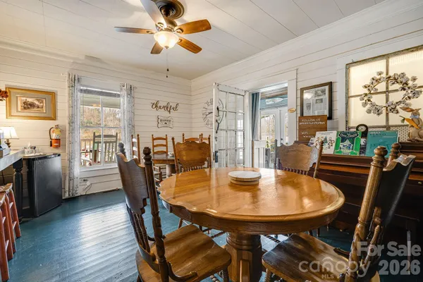 a dining room with furniture and window