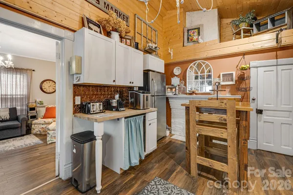 a kitchen with stainless steel appliances a stove and cabinets