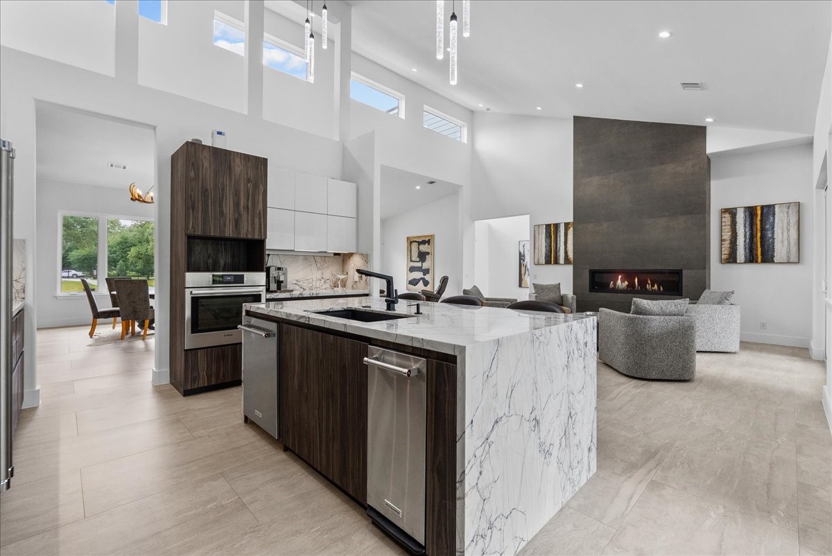 7627 Scott Avenue Manvel, TX 77578 - Photo 17 of 50 A massive waterfall island is the highlight of this kitchen. Imported Italian granite adorns this flowing kitchen island.