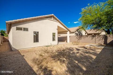 40620 North Key Lane Anthem, AZ 85086 - Photo 21 of 24 a view of a house with a yard