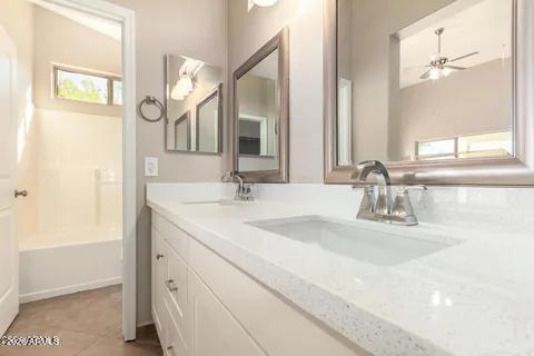 40620 North Key Lane Anthem, AZ 85086 - Photo 5 of 24 a bathroom with a sink and a mirror