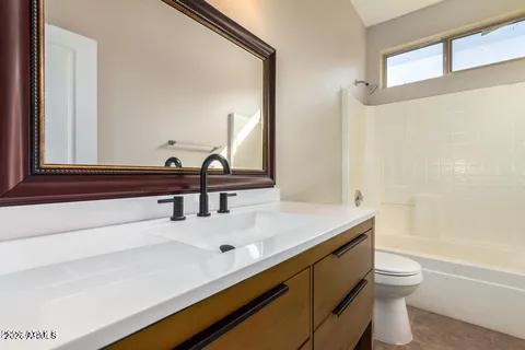 40620 North Key Lane Anthem, AZ 85086 - Photo 6 of 24 a bathroom with a sink vanity toilet and a mirror