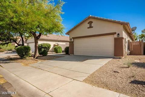 40620 North Key Lane Anthem, AZ 85086 - Photo 8 of 24 a front view of a house with a yard and garage