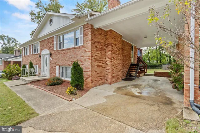 a view of a street with potted plants