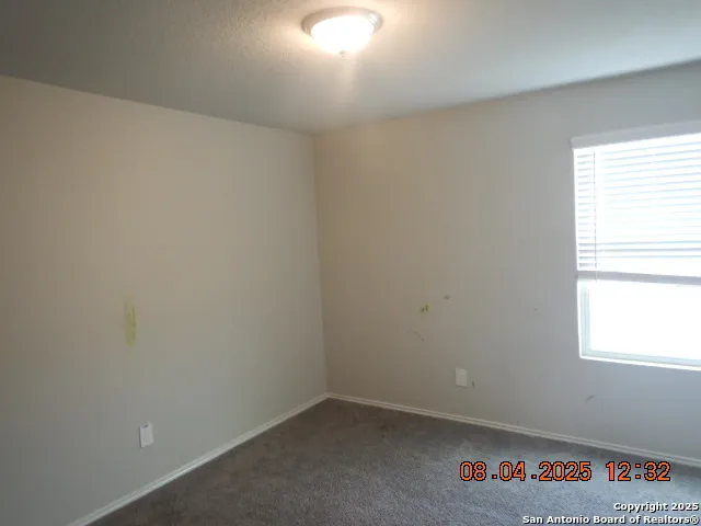 a white toilet sitting next to a bath tub