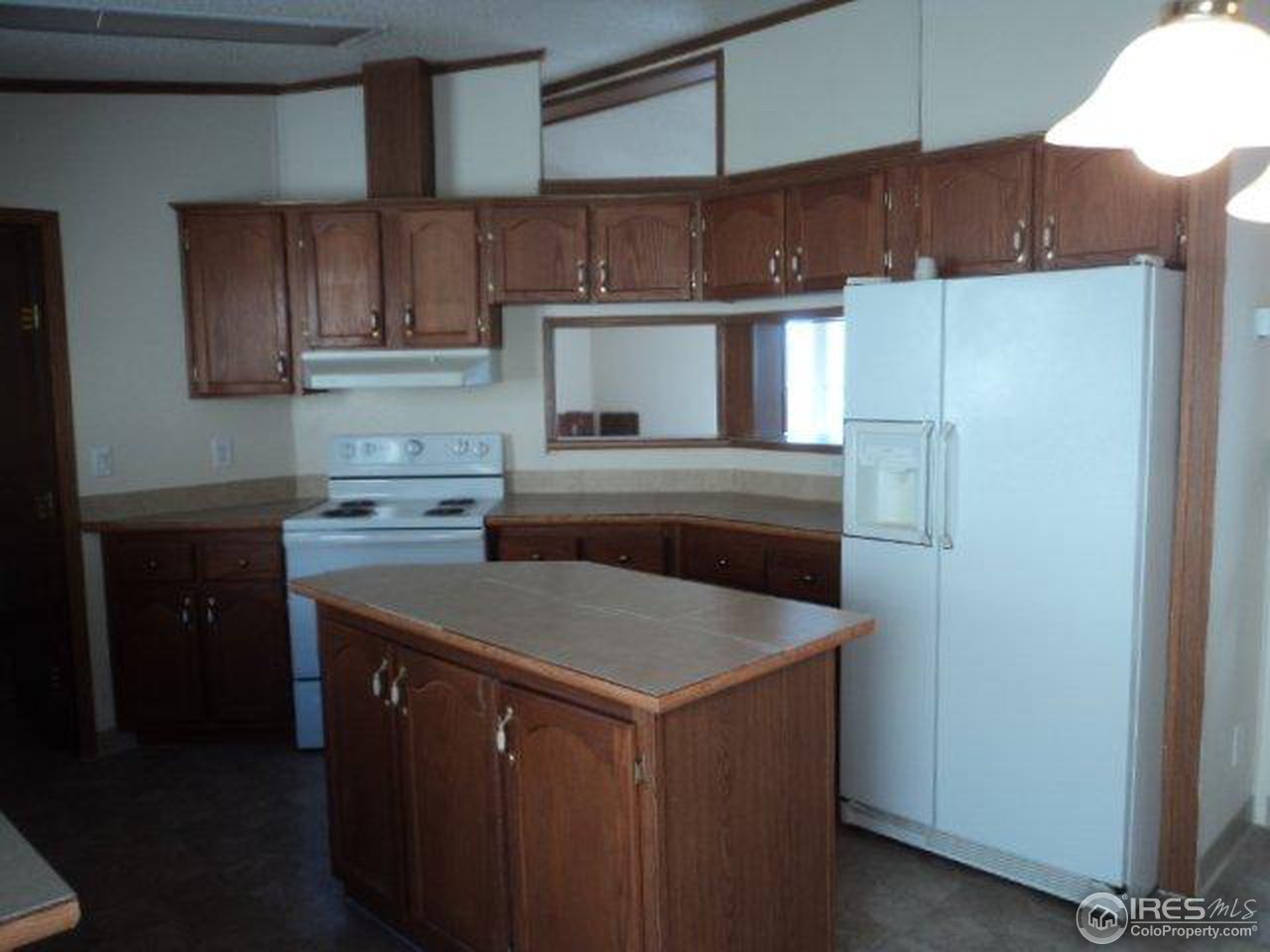 37 Caesar Road Black Hawk, CO 80422 - Photo 6 of 21 a kitchen with a sink refrigerator and cabinets