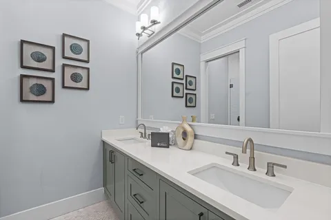 a utility room with sink dryer and washer