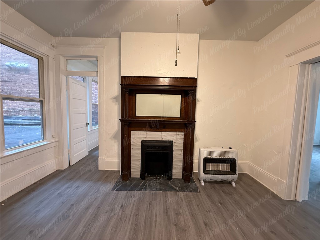 44 West High Street, Unit B Springfield, OH 45502 - Photo 17 of 31 This inviting space features classic architectural details with modern flooring and abundant natural light.