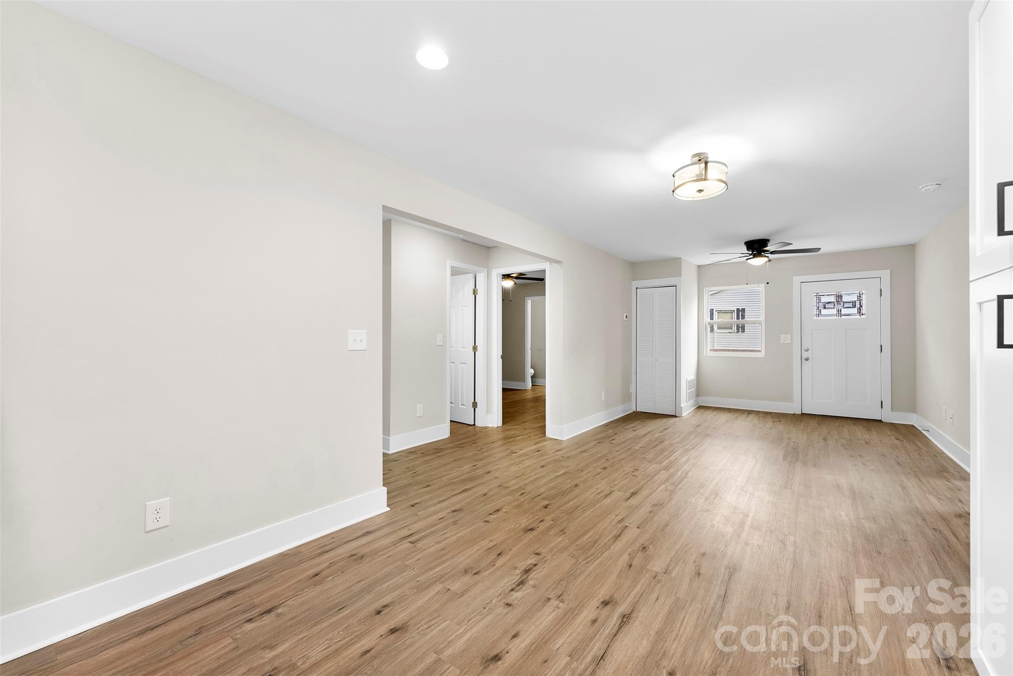 601 Rhyne Circle, Unit B Gastonia, NC 28054 - Photo 11 of 32 an empty room with wooden floor and windows