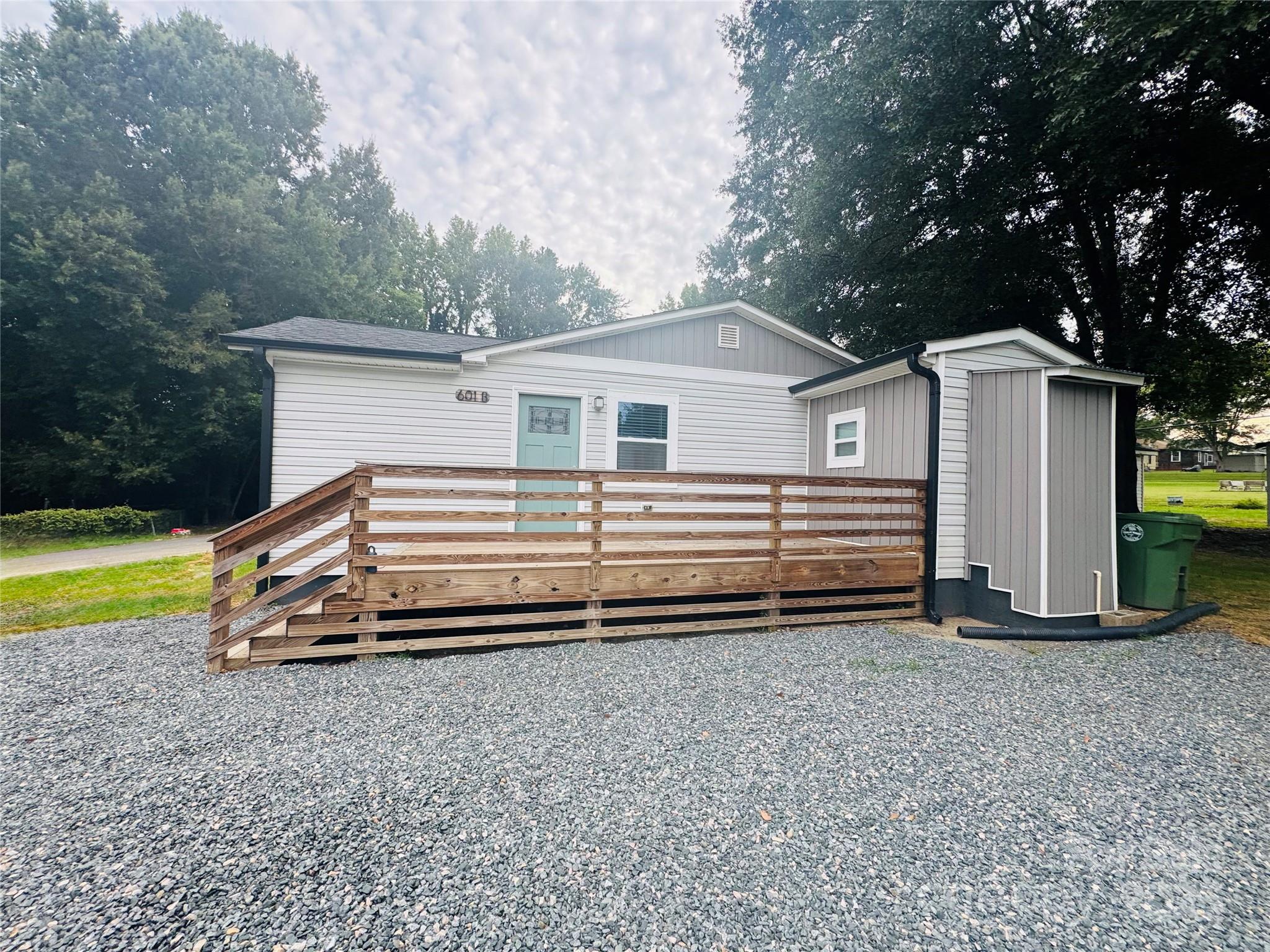 601 Rhyne Circle, Unit B Gastonia, NC 28054 - Photo 2 of 32 a view of a house with a yard and a large tree