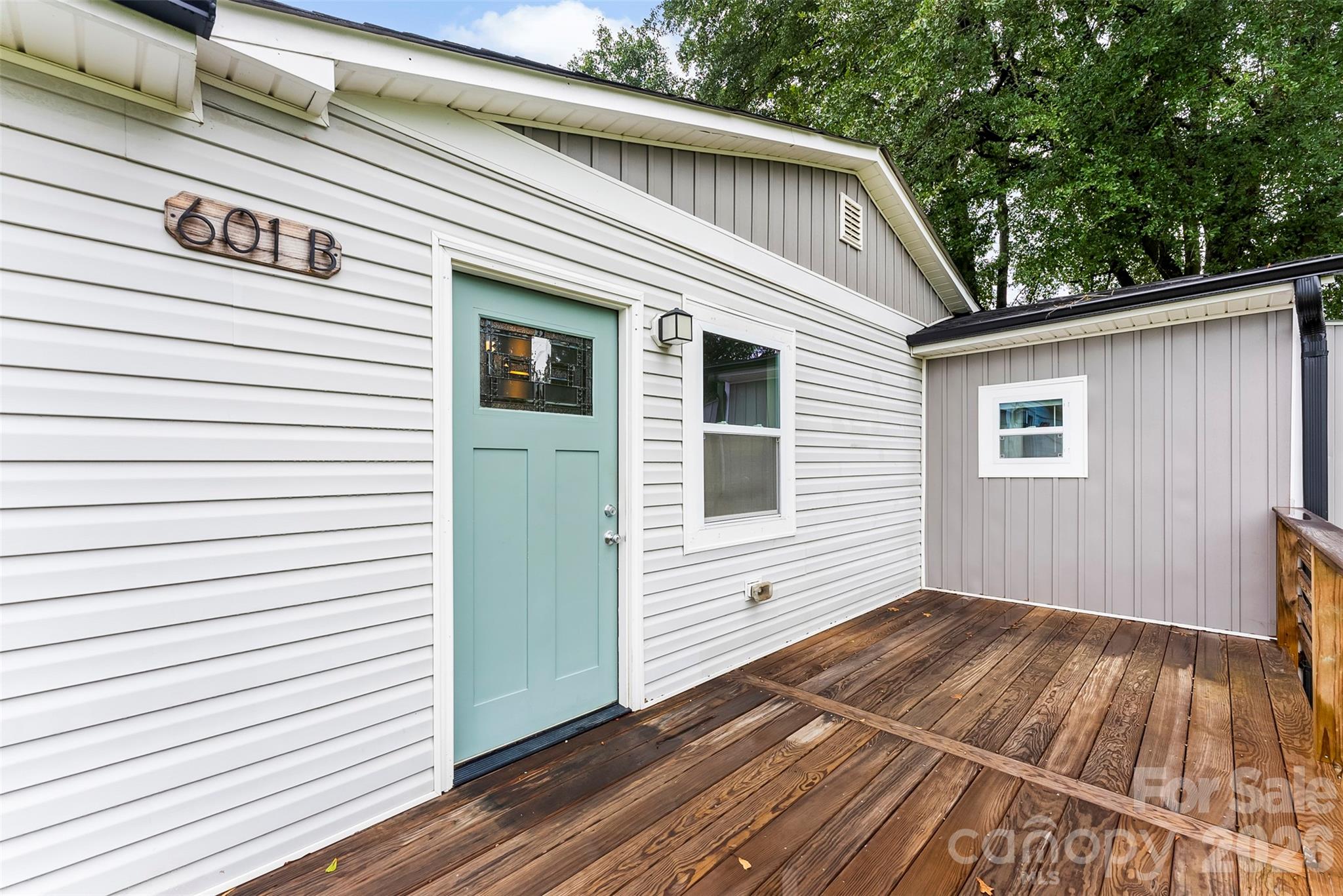 601 Rhyne Circle, Unit B Gastonia, NC 28054 - Photo 3 of 32 a view of a house with a door and wooden floor