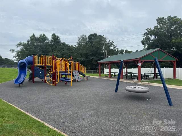 a view of swimming pool with sitting area and roof