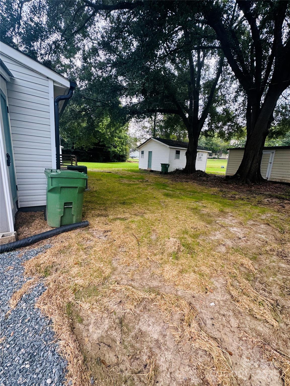601 Rhyne Circle, Unit B Gastonia, NC 28054 - Photo 32 of 32 a view of a backyard with large tree and a small yard
