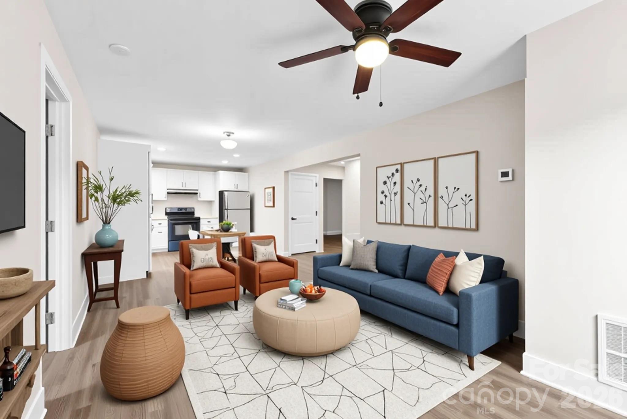 601 Rhyne Circle, Unit B Gastonia, NC 28054 - Photo 5 of 32 a living room with furniture and a flat screen tv