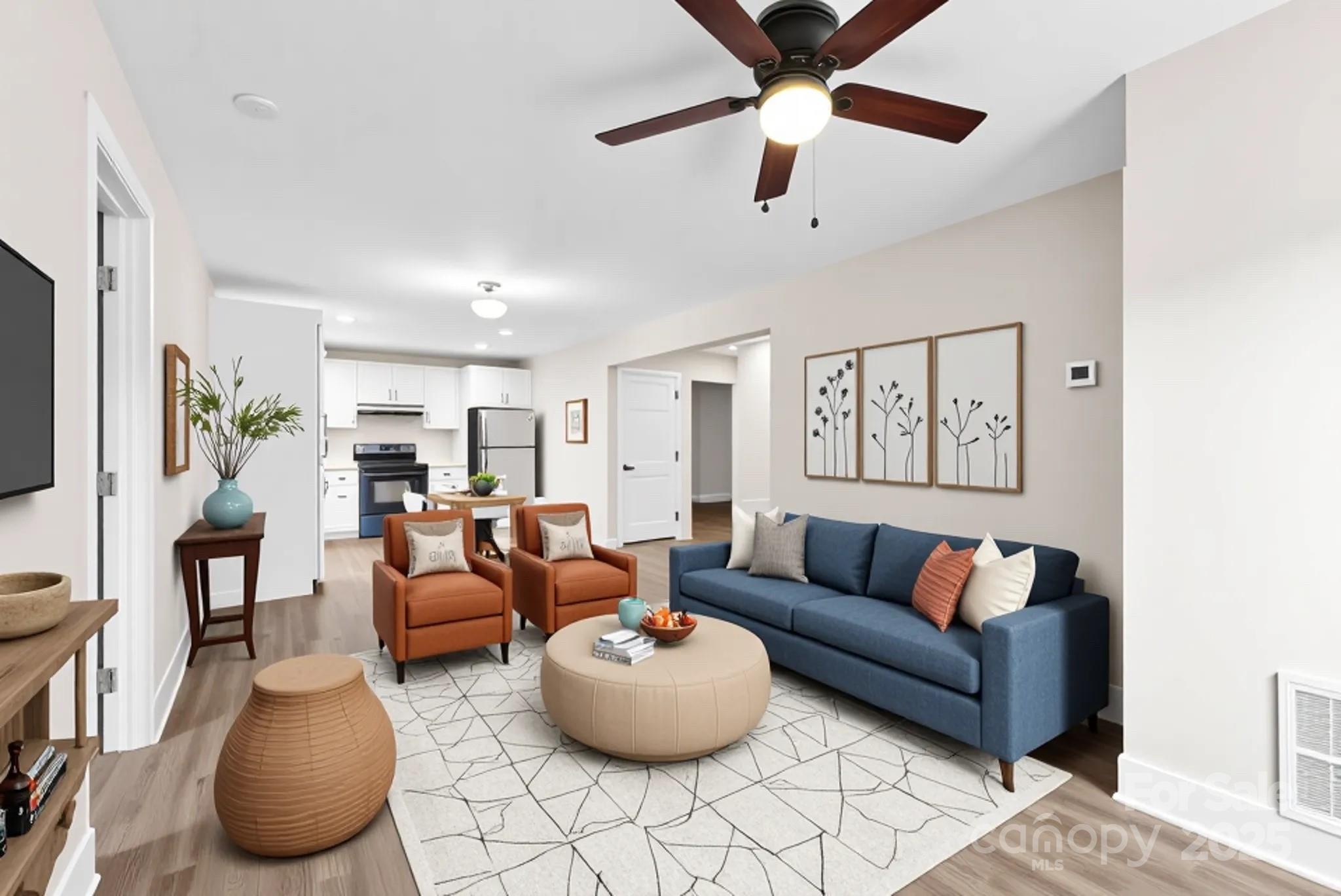 601 Rhyne Circle, Unit B Gastonia, NC 28054 - Photo 5 of 32 a living room with furniture and a flat screen tv