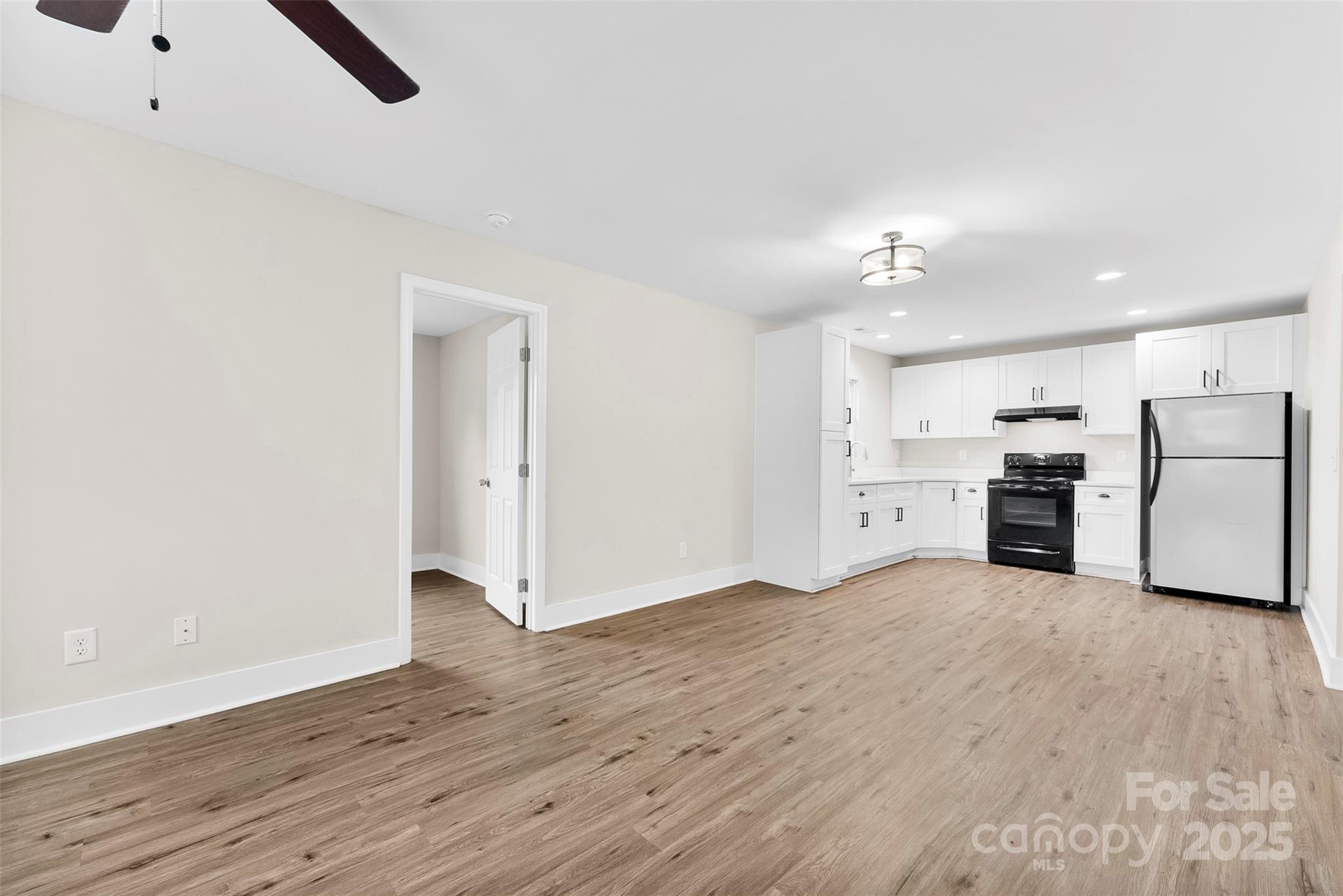 601 Rhyne Circle, Unit B Gastonia, NC 28054 - Photo 7 of 32 a view of a kitchen with a sink stove cabinets and empty room