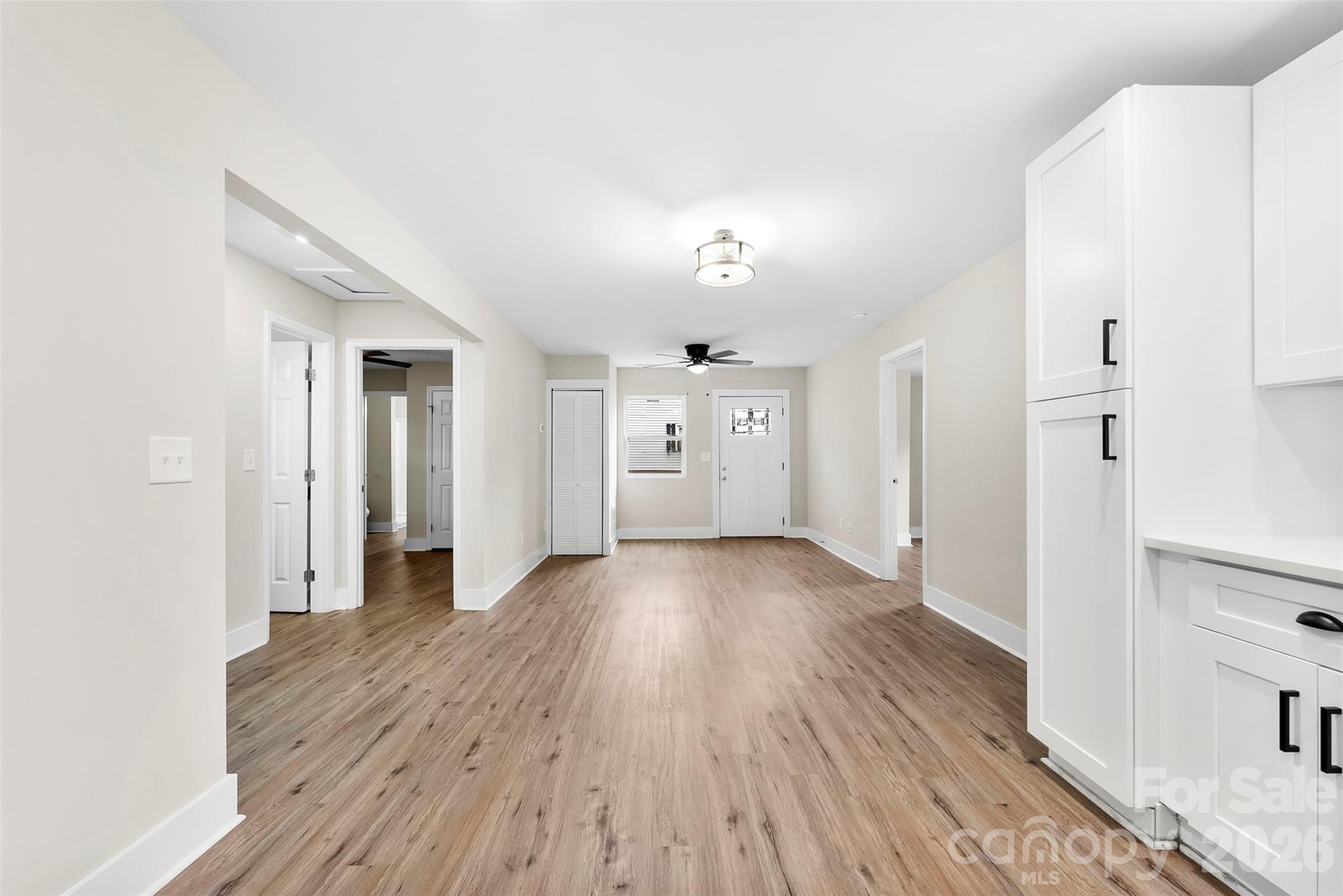 601 Rhyne Circle, Unit B Gastonia, NC 28054 - Photo 8 of 32 a view of a big room with wooden floor and windows