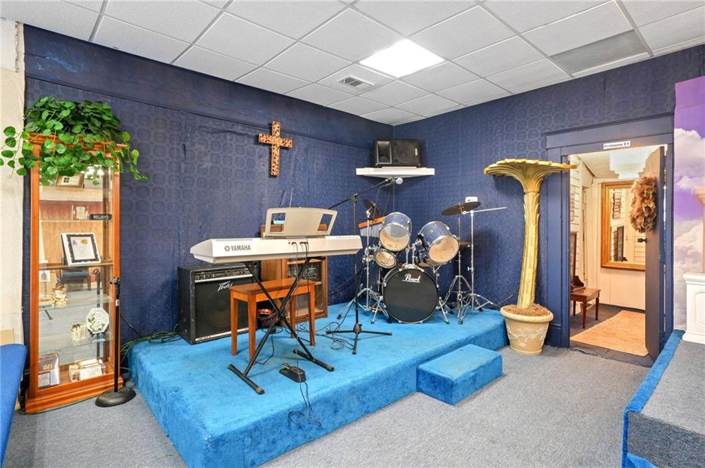 1583 Ralph David Abernathy Boulevard Southwest Atlanta, GA 30310 - Photo 13 of 24 a view of a dining room with furniture one side kitchen view and wooden floor