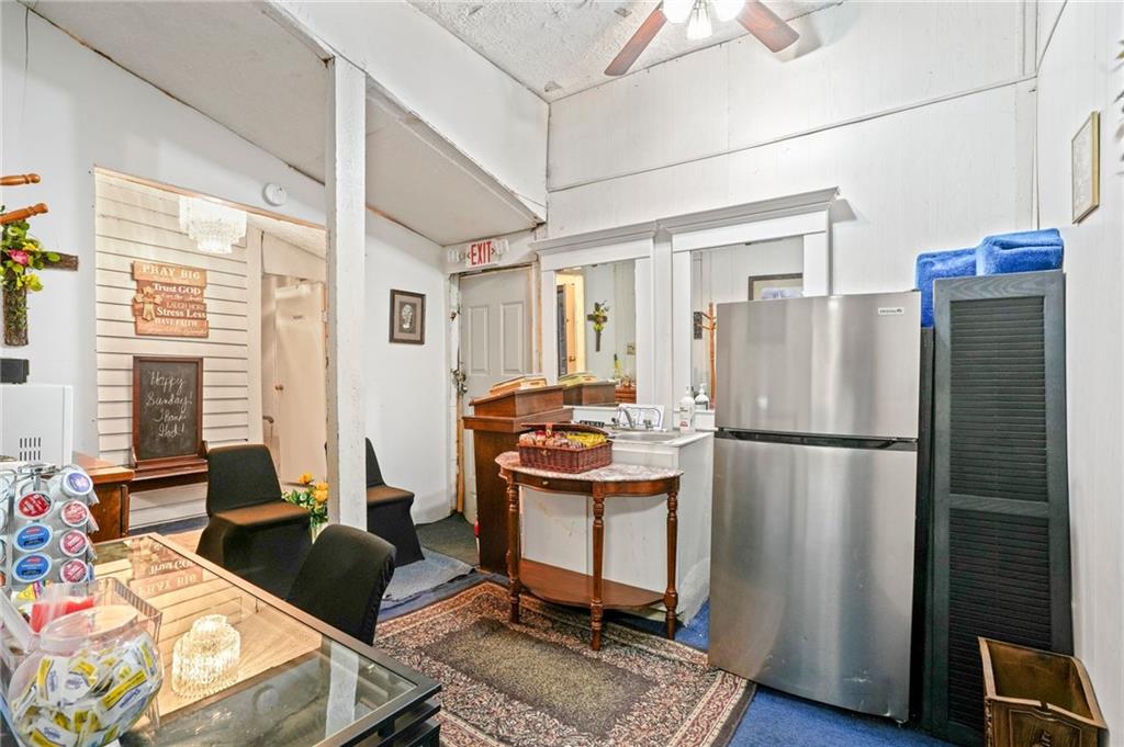 1583 Ralph David Abernathy Boulevard Southwest Atlanta, GA 30310 - Photo 14 of 24 a kitchen with stainless steel appliances granite countertop a refrigerator and a stove