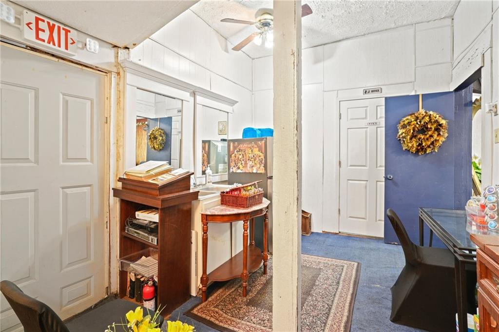 1583 Ralph David Abernathy Boulevard Southwest Atlanta, GA 30310 - Photo 15 of 24 a living room with furniture a rug and a window