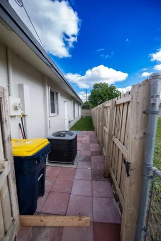 a view of a backyard with a large tree